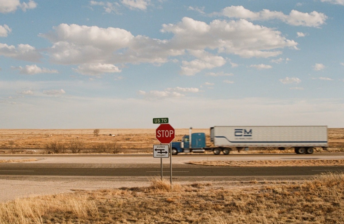 A tractor-trailer running a divided US highway